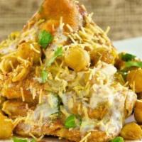 Samosa Chaat · Vegetarian. Crispy fried turnover filled with mildly spiced potatoes, peas, and cilantro ser...