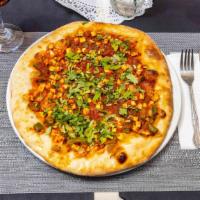 Chilli Paneer Masala Pizza · Homemade Indian cheese sauteed, chilli peppers, tomatoes, green peppers in spicy sauce.
