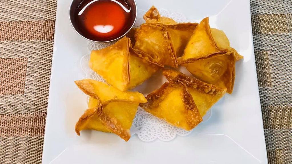 Crab Wonton (5) · Cream cheese mixed with imitation crab stick wrapped in wonton skin served with sweet and sour sauce.