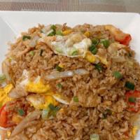 Fried Rice · Stir-fried jasmine rice with soy sauce white onions, scallion, tomatoes and egg.