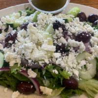 Greek Salad · Romaine lettuce, red onion, cucumber, tomatoes, Feta cheese, kalamata olives with our homema...