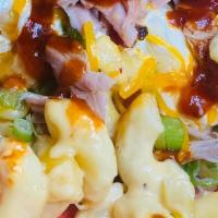 Loaded Mac And Cheese · mac and cheese and choice of meat with bacon chives cheese and sour cream