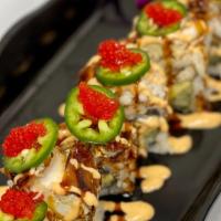 Mcguiver Roll · Eel, Avocado, and Cream Cheese inside. Topped with Soft-Shell Crab, Sauces, Jalapeno, Red To...