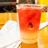 Hibiscus Raspberry Iced Tea · Made in house and served in a 20oz cup. Sweetened upon request with our Organic Lemonade.