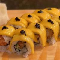 Mango Tango · Shrimp tempura and cucumber inside with mango and tobiko on top, drizzled with spicy mayo.