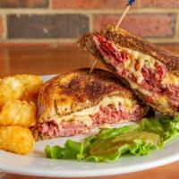 Reuben · Tender corned beef with melted Swiss,
thousand island dressing, and sauerkraut,
piled onto m...