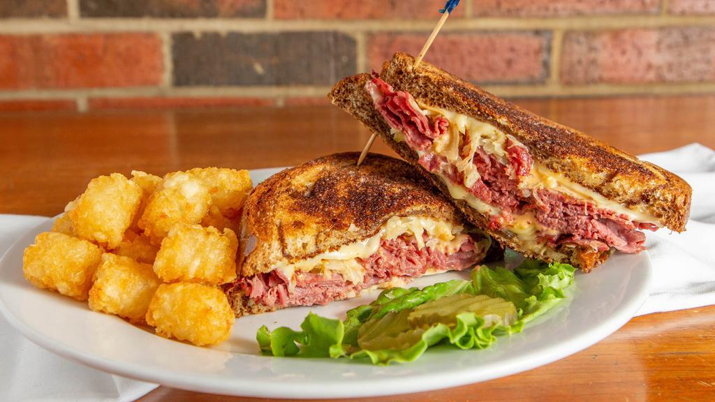 Reuben · Tender corned beef with melted Swiss,
thousand island dressing, and sauerkraut,
piled onto marbled rye.