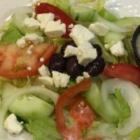 Greek Salad · Lettuce, tomatoes, cucumbers, onions and black olives served with Greek salad dressing and F...