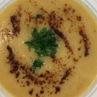 Lentil Soup · Silky lentil soup with cumin, topped with parsley and paprika.