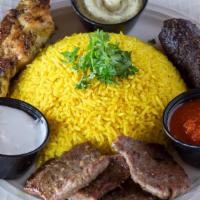 Mixed Grill Platter · Grilled kefta, gyro beef, grilled chicken skewers shish tawook, served with garlic, tahini a...