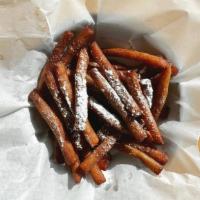 Funnel Cake Fries · Fried cake dough tossed in cinnamon sugar and topped with powdered sugar