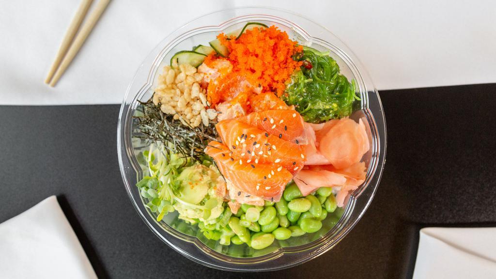 Spicy Mayo Salmon Bowl · Our Spicy Mayo Salmon bowl with avocado, masago, cucumber, green onion, seaweed salad, crab salad, micro greens, edamame and topped with dry nori seaweed, tempura crunch and sesame seeds.