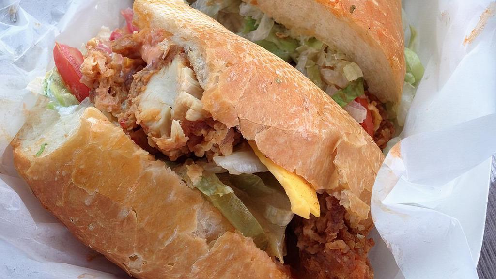 Fried Chicken Po Boy Sandwich · Spicy. Deep-fried chicken breast strips. Served with traditional toppings, fry sauce, and ketchup. Dressed with mayonnaise, lettuce, tomatoes, pickles, and hot sauce. Served on french bread.