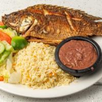 Pescado Frito (Fried Fish) · Salvadoran style pan-fried a whole fish accompanied with rice, refried beans and salad.