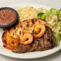 El Pulgarcito (House Special) · Carne asada, broiled chicken, with three shrimp Sautéed buttery wine sauce topper over rice ...