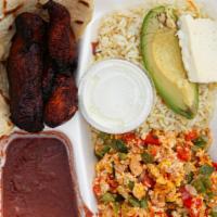 Desayuno · Two Egg cook scramble or rancho accompanied with plantain, a refried bean, rice, Salvadoran ...