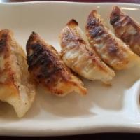 Gyoza · Pan-Fried pork dumplings. 6 pieces