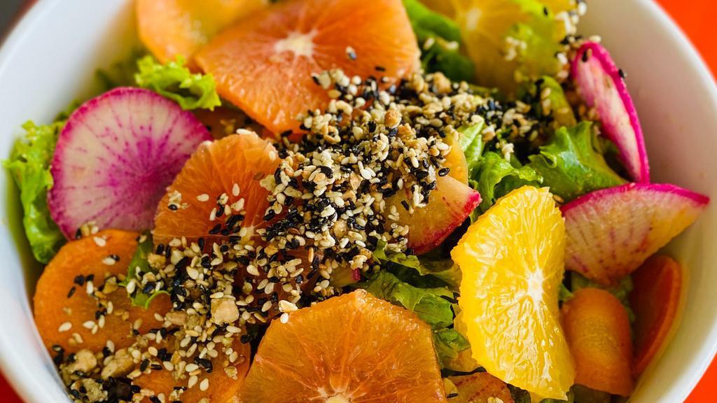Market Greens Salad · Lunch sized mixed greens, oranges, pickled carrots,
radishes, spiced almonds and sesame seeds,
Korean chile dressing (v)