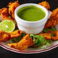 Fish Pakora · Chickpea flour battered tilapia slices deep fried and lightly seasoned with imported spice