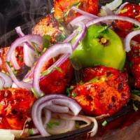 Chicken Tikka · chicken marinated in a yogurt,lemon and imported spice then roasted