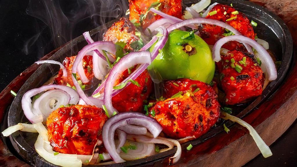 Chicken Tikka · chicken marinated in a yogurt,lemon and imported spice then roasted