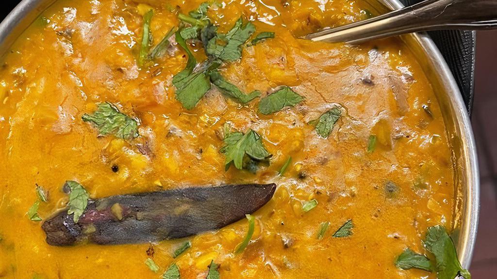 Dal Tadka · Yellow lentils cooked with onion,tomatoes,ginger,garlic with cumin seeds