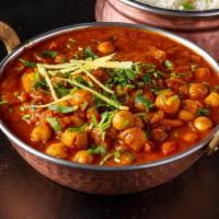 Chana Masala · ChickPeas(garbanzo beans) cooked with onions,tomatoes simmered in imported spices