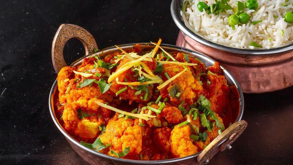 Aloo Gobi · Cauliflower,potatoes,tomato cooked with onions and indian imported spices