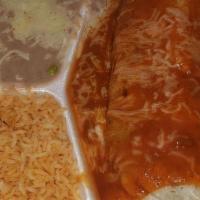 Wet Burrito · Chicken burrito (beans, pico de Gallo, and cheese) smothered in our enchilada sauce.  with r...