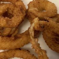 Onion Rings · Texas onions breaded and lightly fried.