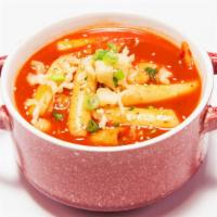 Tteokbokki · Rice cake in our homemade spicy sauce.  Topped with scallion.