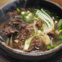 Bulgogi Tang · Bulgogi, rice cake, Korean glass noodle, shiitake mushroom, jalapeño pepper and scallion boi...