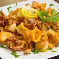 Fried Calamari · Fried Light and Crispy. Served with dipping sauce.
