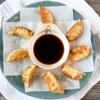 Gyoza · 8 Japanese dumplings filled with chicken and vegetables, served either fried or steamed with...