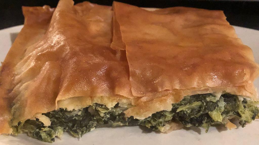 Spanakopita · Chopped spinach with feta cheese and spices all layered in filo dough.