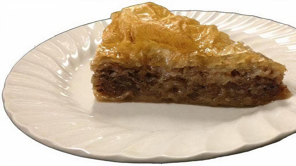 Baklava · A delicious pastry made with layers of fillo dough and chopped walnuts, served with syrup.