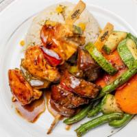 Beef And Chicken Kabobs · Choice beef tenderloin and white chicken breast skewered with fresh seasonal veggies and gri...
