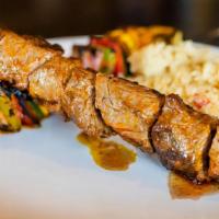 Steak Kabobs · Marinated steak grilled with onions, mushrooms, red bell peppers, zucchini and pineapple. Gl...