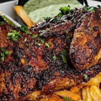 Peruvian Roasted Chicken · Half chicken marinated and roasted. 
Served with hand cut fries