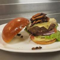 Black Bean Burger · A grilled black bean burger topped with Monterey Jack cheese, fresh avocado, sliced tomato a...