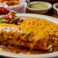 Fajita Chimichanga · Large homemade soft flour tortillas stuffed with your choice of meat and deep fried, topped ...