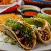 Tres Amigos Tacos · One beef taco, one chicken taco, one carnitas taco. Served with rice, charro beans, cilantro...