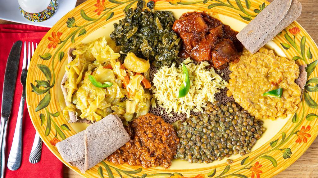 Vegetarian Combo 8 · Your choice of any seven vegetarian menu items. Served with salad and the option of rice or injera.