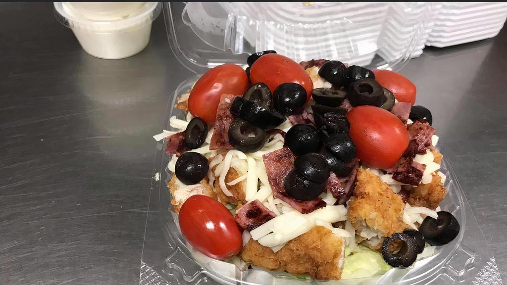 Crispy Chicken Salad  · Crispy chicken, lettuce, grape tomatoes, shredded provolone cheese, pre-cooked bacon, red onions and black olives.