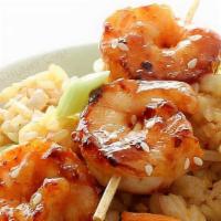 Shrimp · 2 grilled shrimp sticks, 2 egg rolls, over easy egg, white rice, and salad peanut dressing