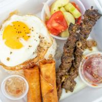 Grilled Beef  · 2 grilled stick, 2 egg rolls,  over easy egg, white rice, and salad peanut dressing