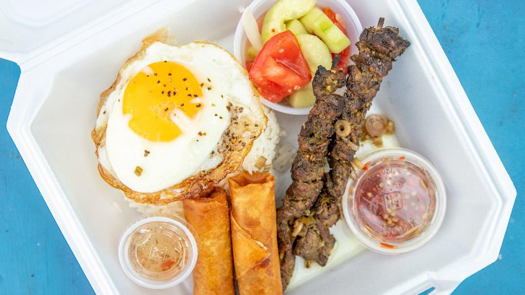 Grilled Beef  · 2 grilled stick, 2 egg rolls,  over easy egg, white rice, and salad peanut dressing