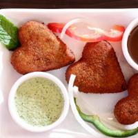 Vegetable Cutlet · Deep fried snack seasoned with mixed vegetables - served with chutney.