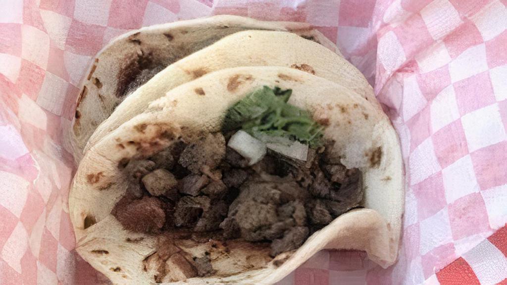 Street Tacos · Asada beef or al pastor pork or chicken breast or Shrimp, on corn tortilla (flour mini tortilla on request, please add Note to your order) with spread of refried beans, onions and cilantro. (add melted cheese or avocado for an additional charge).