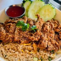 Kao Pad Gai Tod · Deep fried boneless chicken over fried rice with egg, garlic white onion and tomatoes. Toppe...